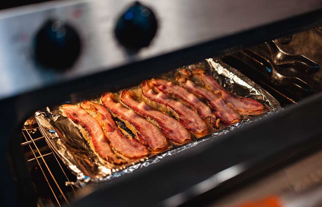 Sheet pan of bacon in the oven